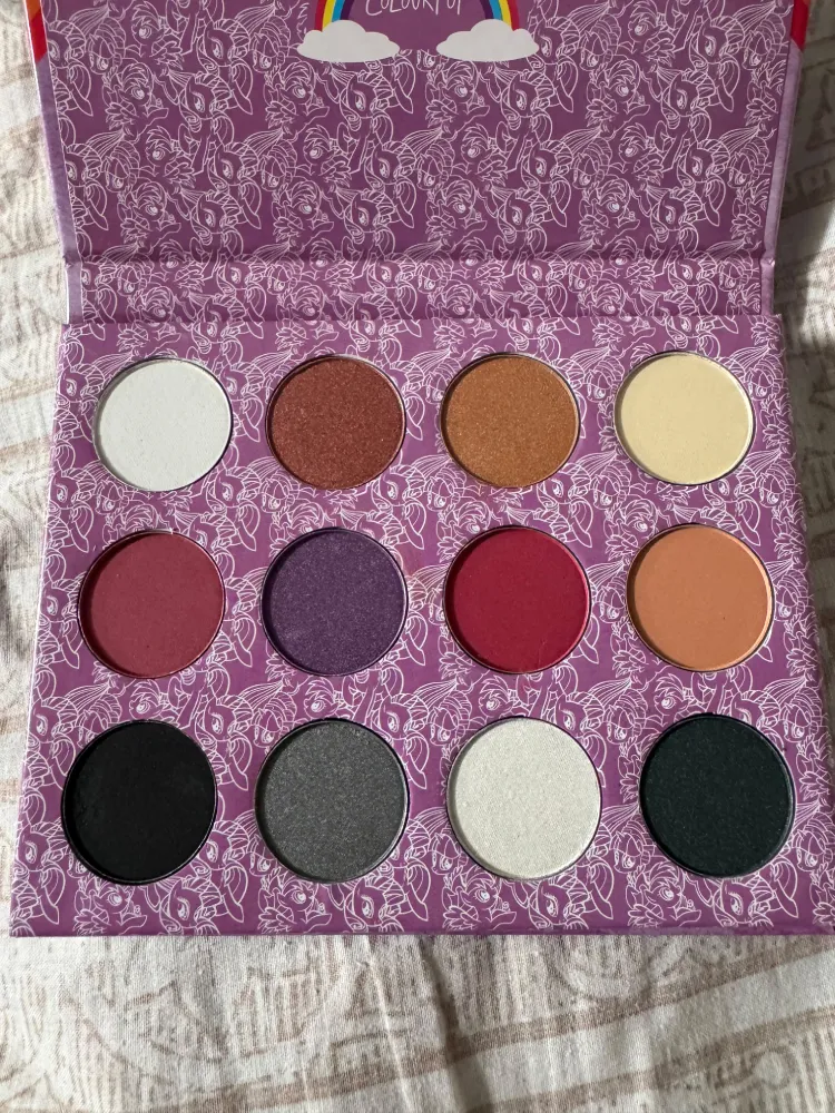 Swatches of the 12 ColourPop My Little Pony palette shades on skin